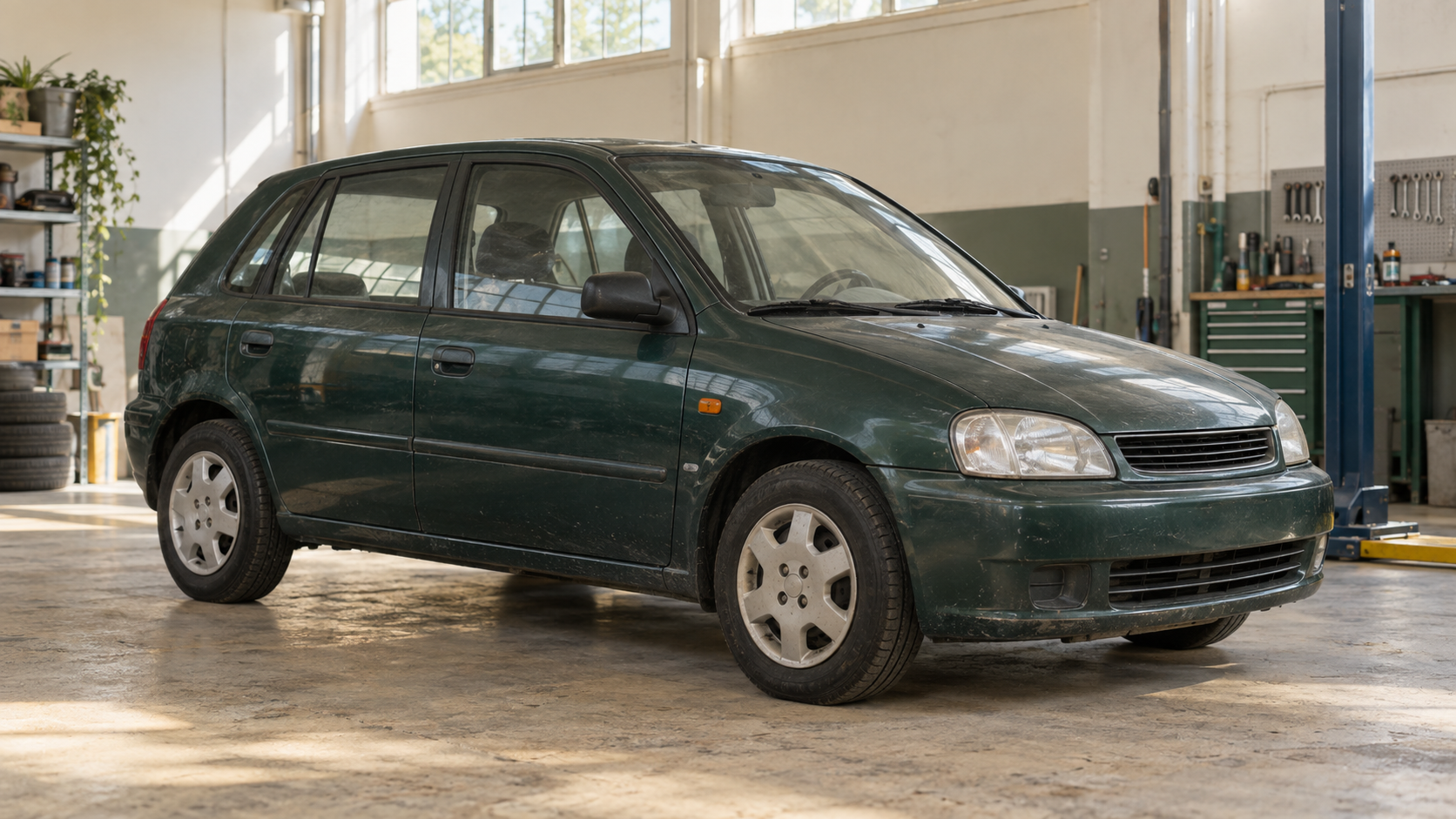 An ordinary car in a workshop, connecting everyday journeys with the work behind them.